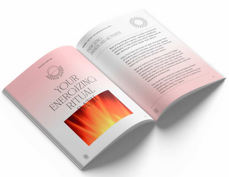 An open booklet or brochure shown at an angle on a light gray background. The pages are white with soft pink gradients and a prominent orange-to-yellow abstract graphic near the bottom of the left page.